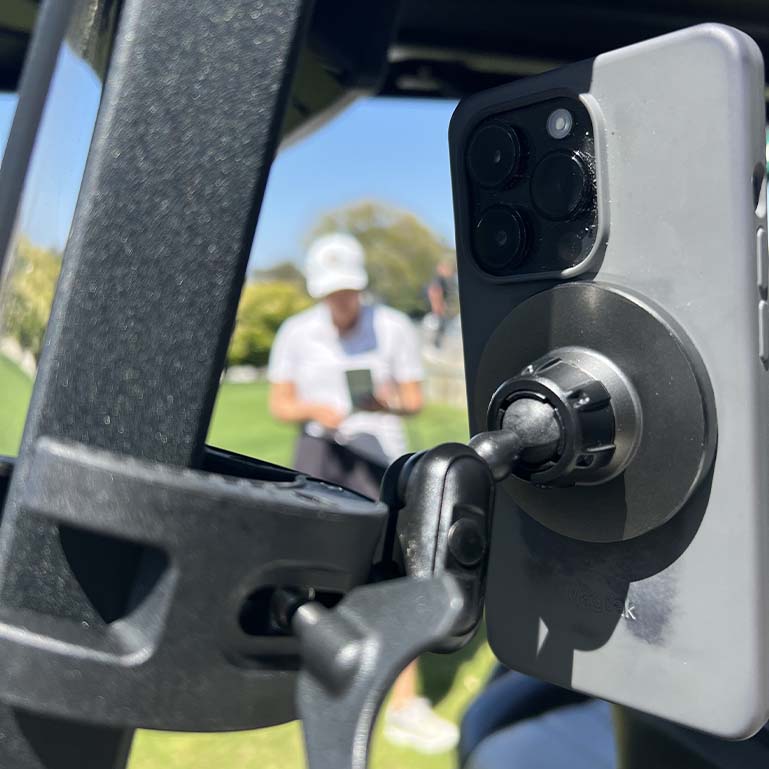 iPhone clipped to a golf cart with Clip-Pod 